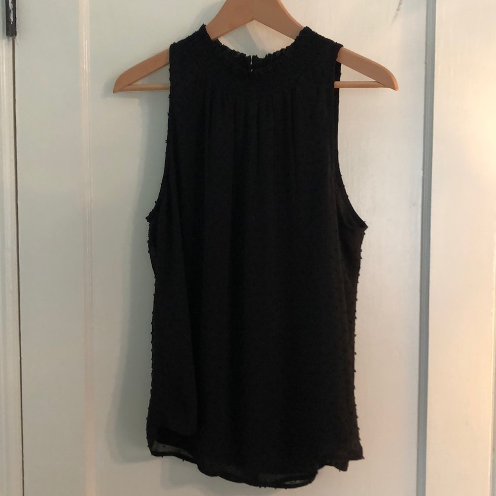 Daniel Rainn black sleeveless top.